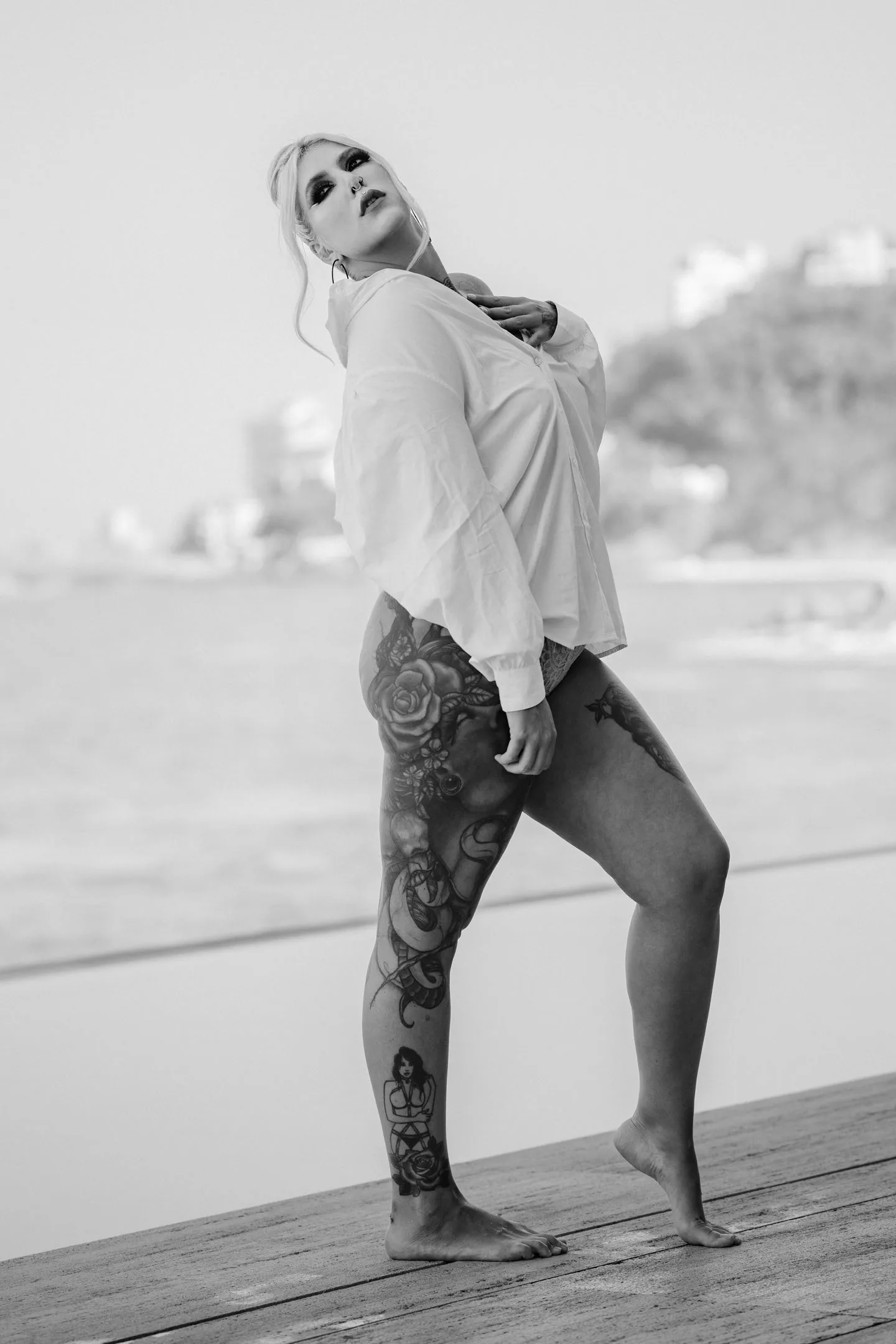 Boudoir Vallarta — black bikini kneeling beach